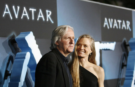 Director of the movie James Cameron and his wife Suzy Amis pose at the premiere of "Avatar" at the Mann